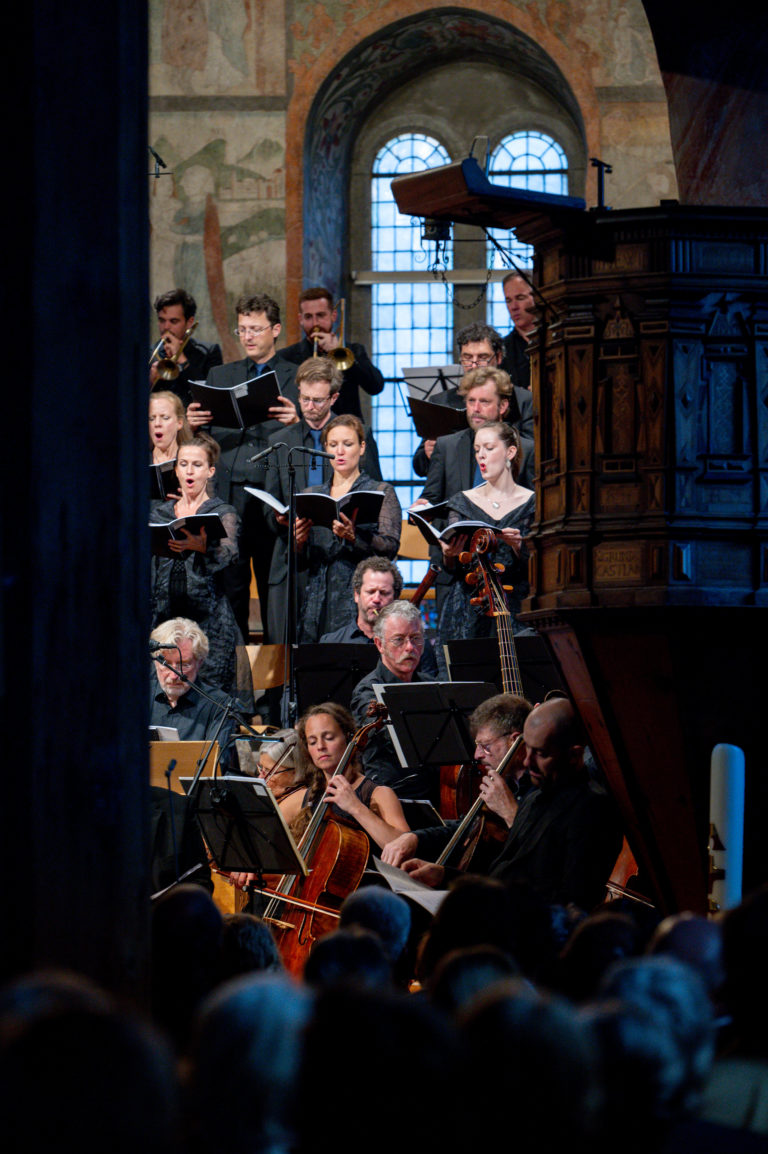 Musicians performing Beethoven's Missa Solemnis at the classic opening concert in Gstaad, with singers and a cellist.