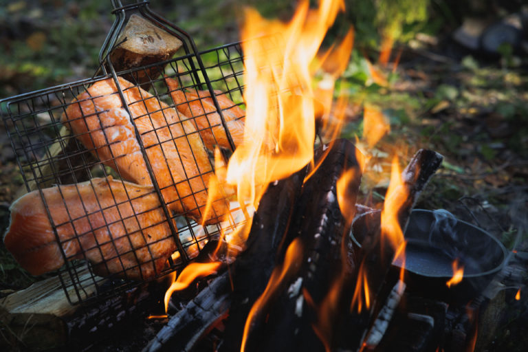 Delicious meal cooked over an open fire in the outdoors