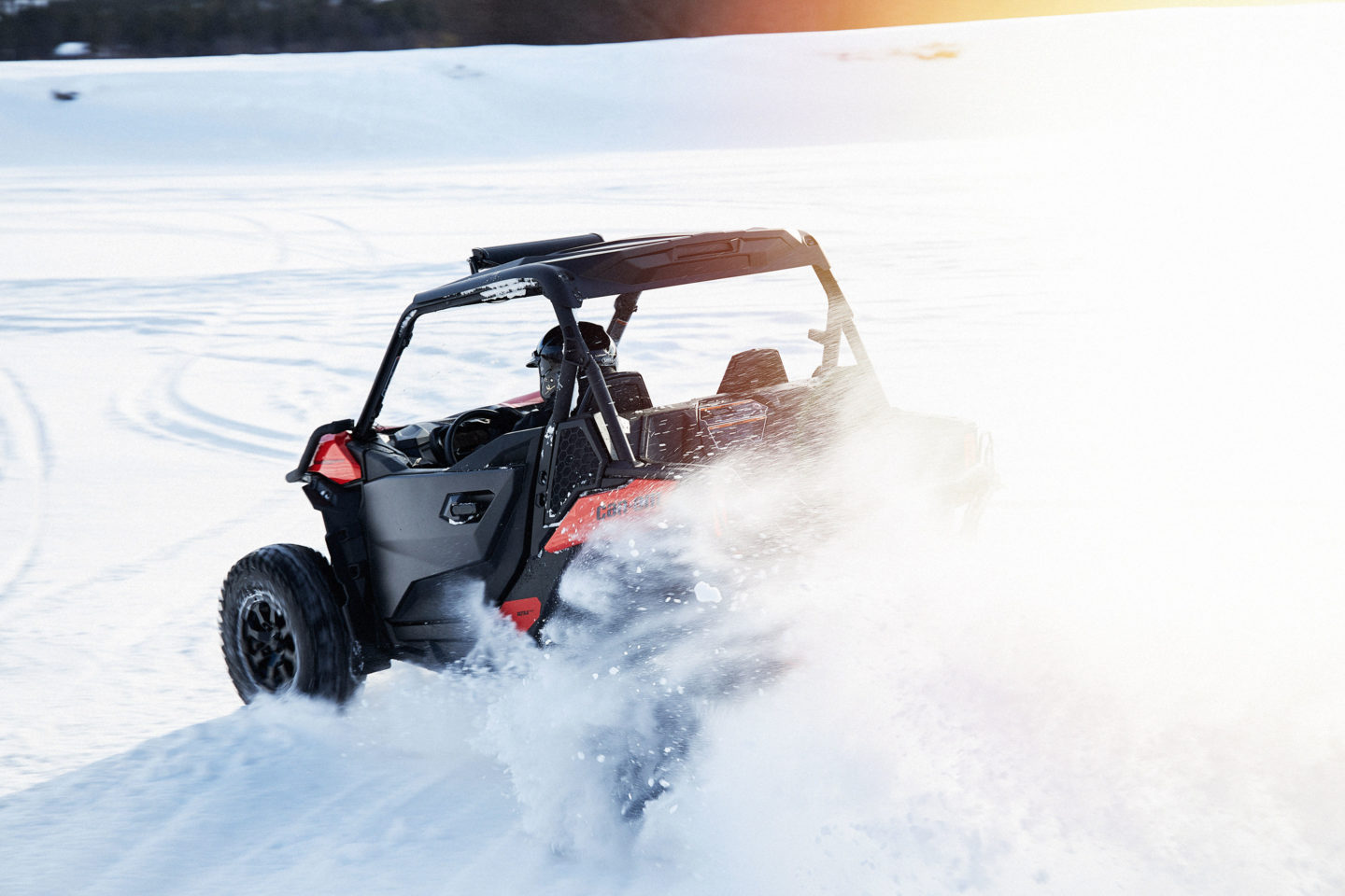 Off-road snowmobile navigating a snowy terrain