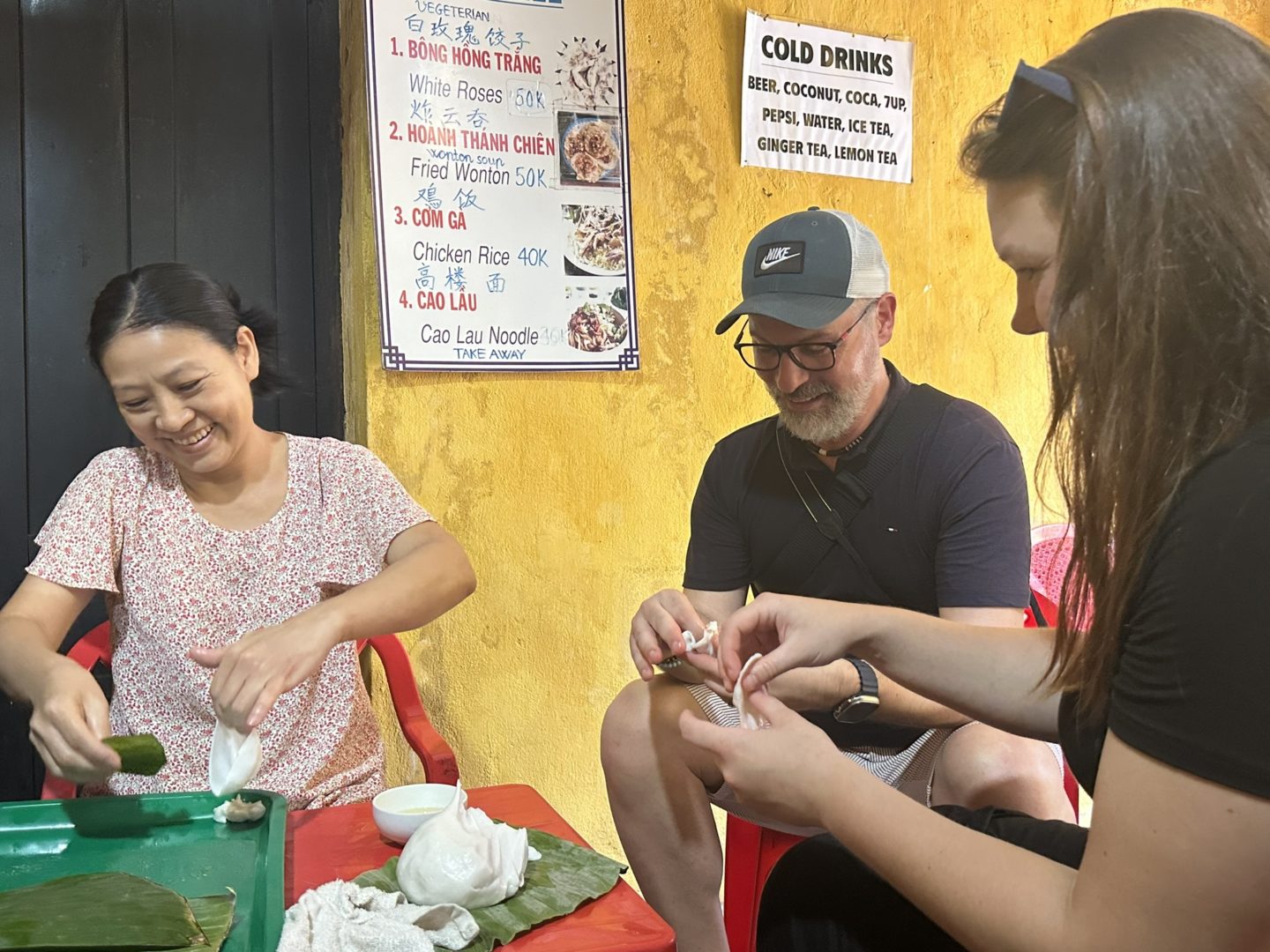 Tourist engaged in dumpling making, showcasing cultural interaction