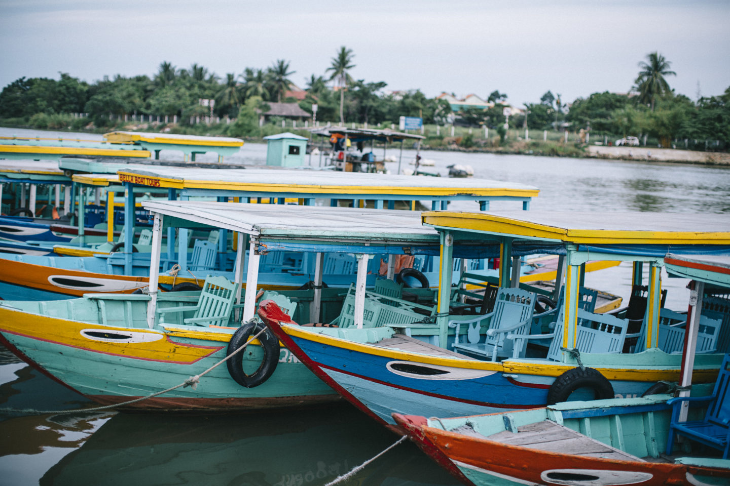 A lineup of colorful boats, creating a striking visual along waterfront