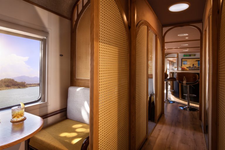 A semi-private carriage of The Vietage train in Vietnam, with a picturesque window view