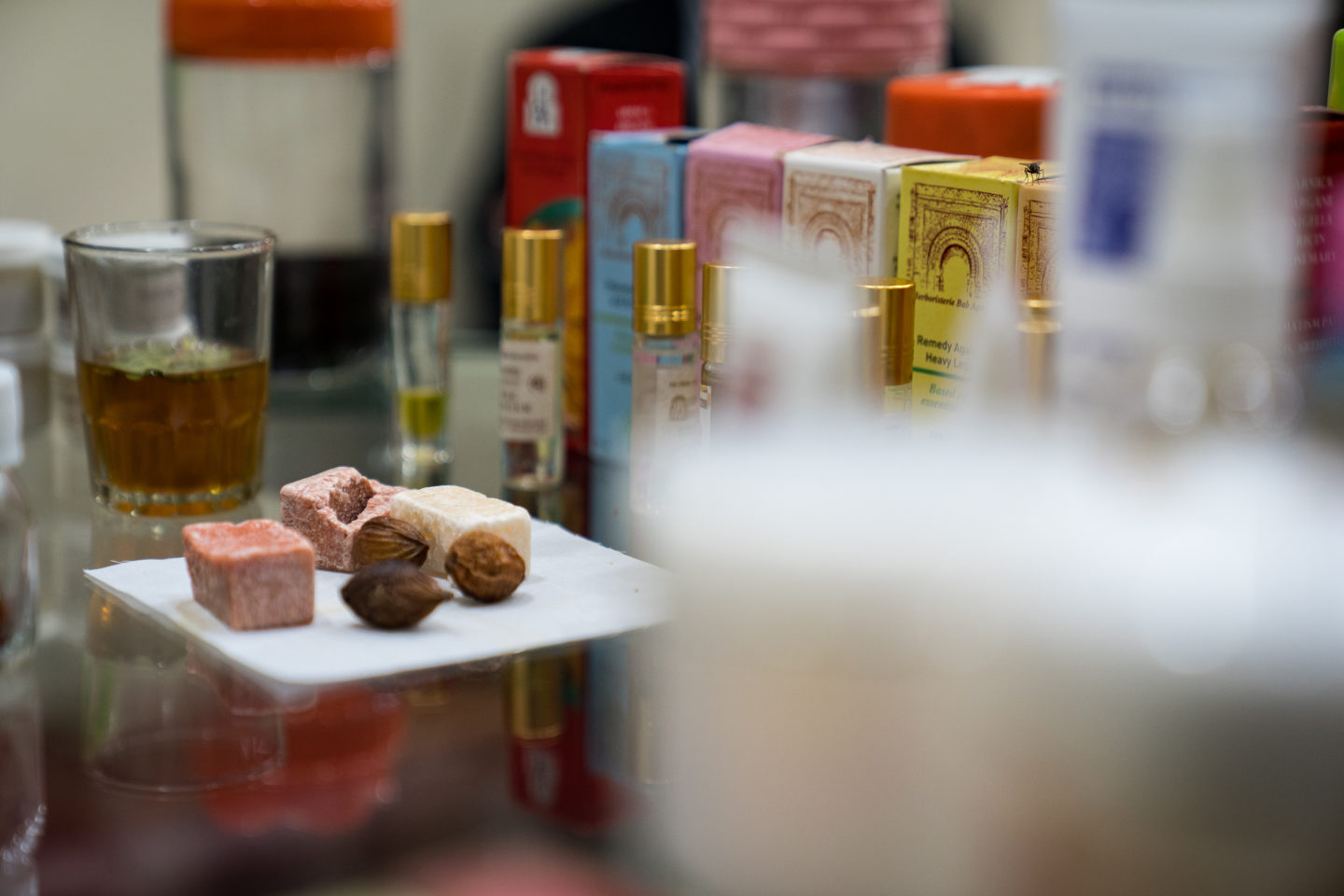 A variety of perfume bottles and other beauty products displayed on a table