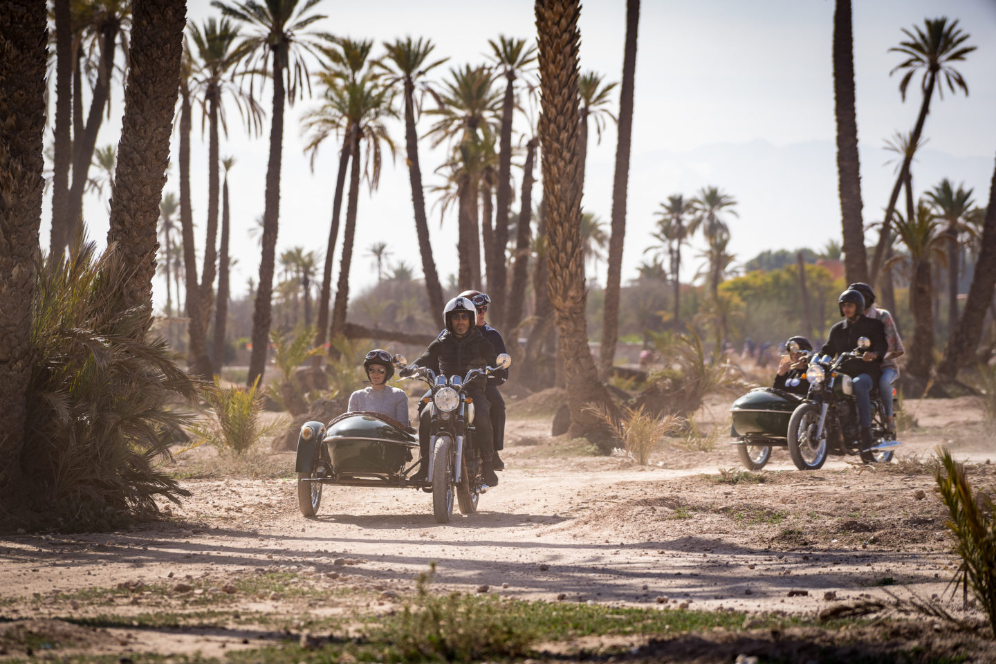 Off roading on classic sidecar motorcycle in a sandy desert environment