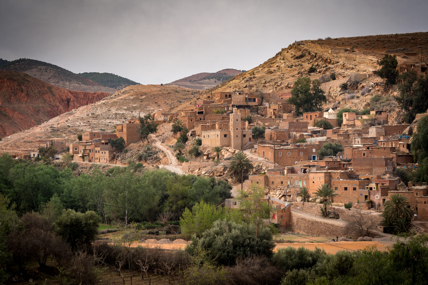 Traditional Berber village nestled in the Atlas Mountains, with mud-brick houses