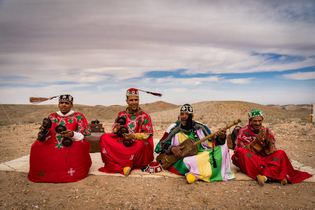 Men playing music in the Agafay Desert, embracing the tranquility of Marrakech