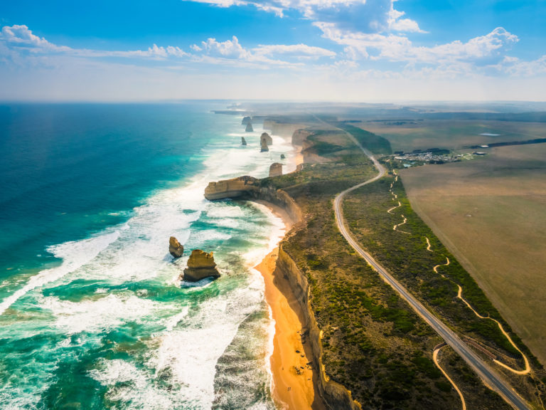 Aerial view of the Great Ocean Road, showing the Twelve Apostles and the rugged coastline