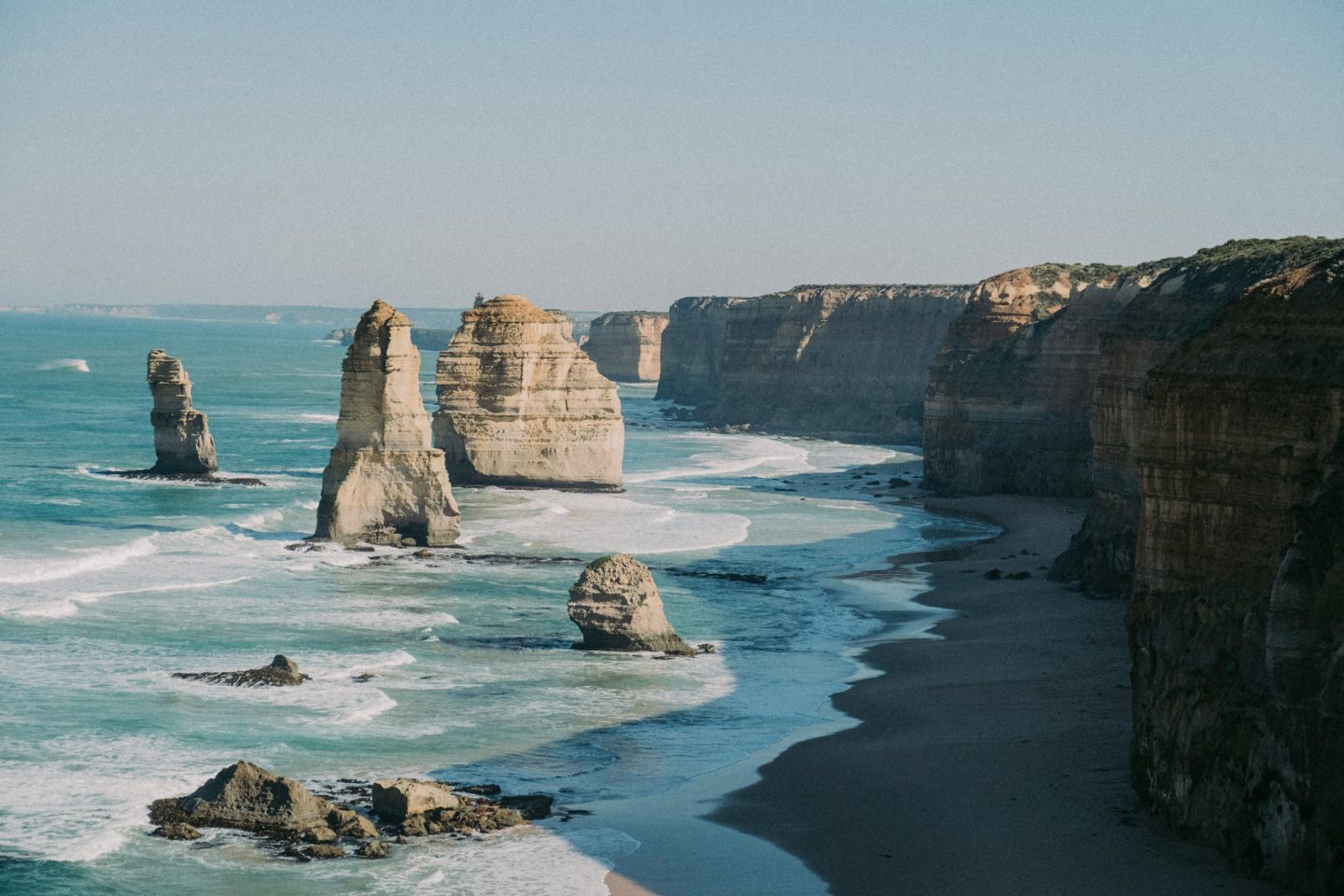 View of the Twelve Apostles along the Great Ocean Road near Melbourne, showcasing dramatic formations rising from the ocean.