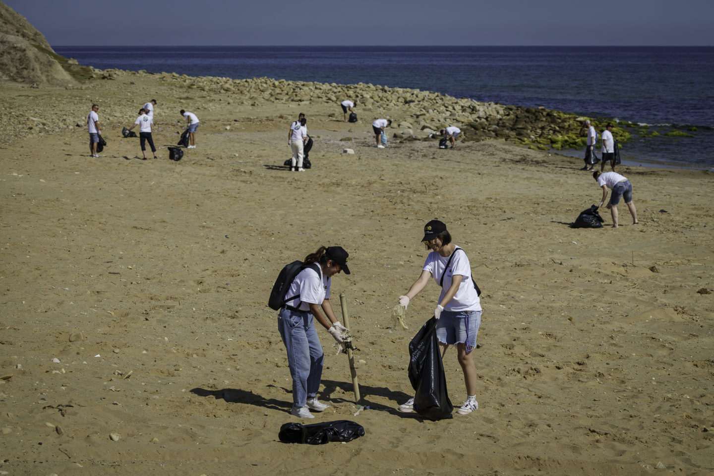 A group of woman collecting trash at a beach during an incentive near Istanbul in Turkey.