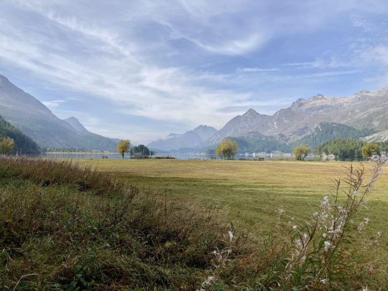 The tranquil Lake Sils nestled between the mountains.