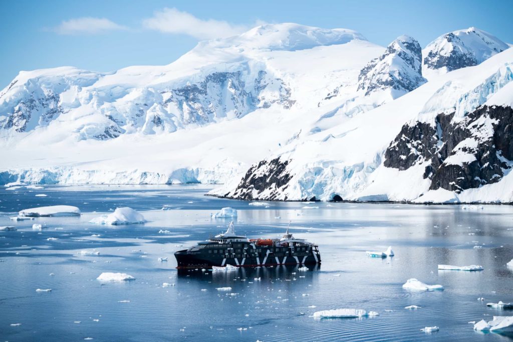 Cruise ship navigates icy waters in breathtaking environment of the Antarctic