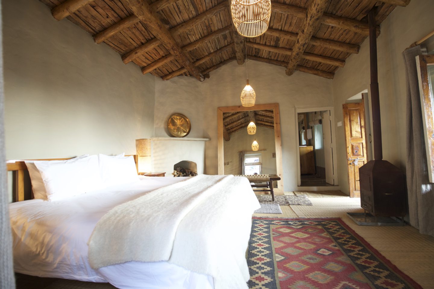 Comfortable room with a rustic aesthetic and a warm, earthy feel