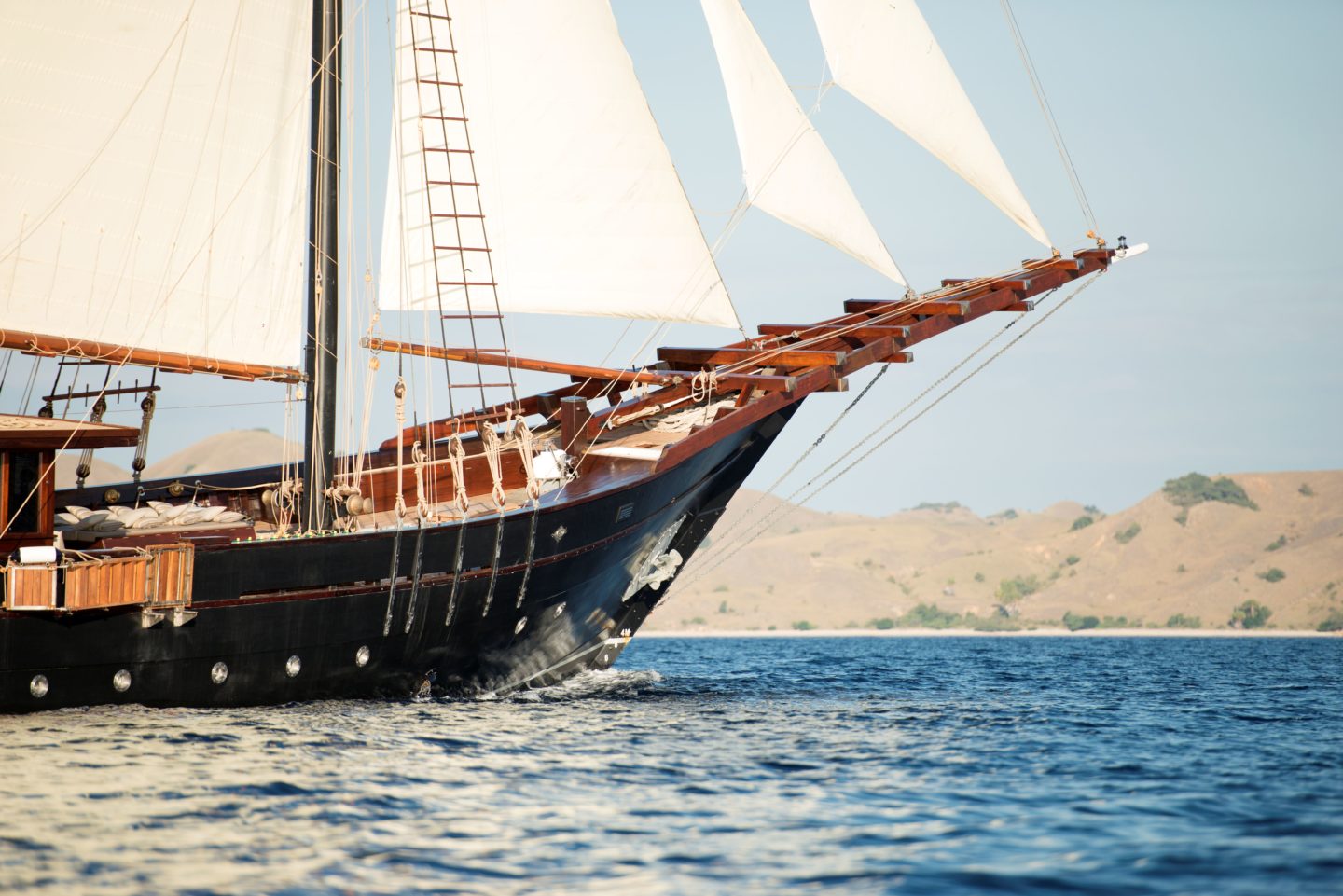 Yacht sails in Raja Ampat's waters, embodying luxury and adventure
