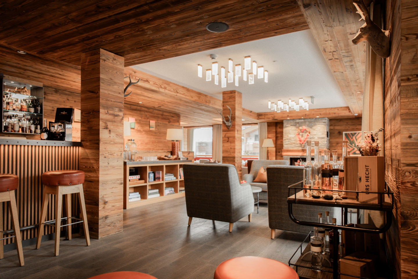 The Capra lounge bar with a warm wooden ceiling and comfortable chairs
