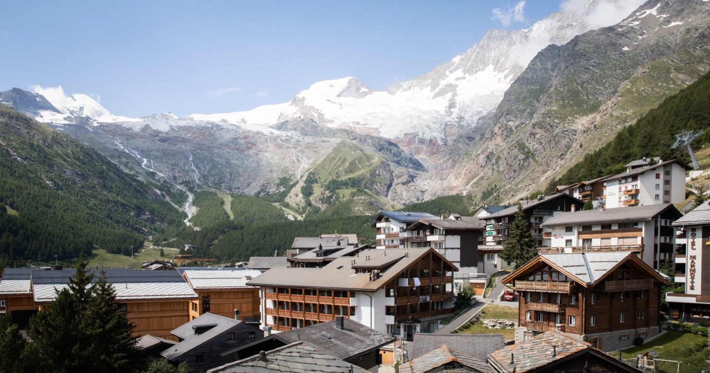 An alpine village scene showcasing The Capra lodge
