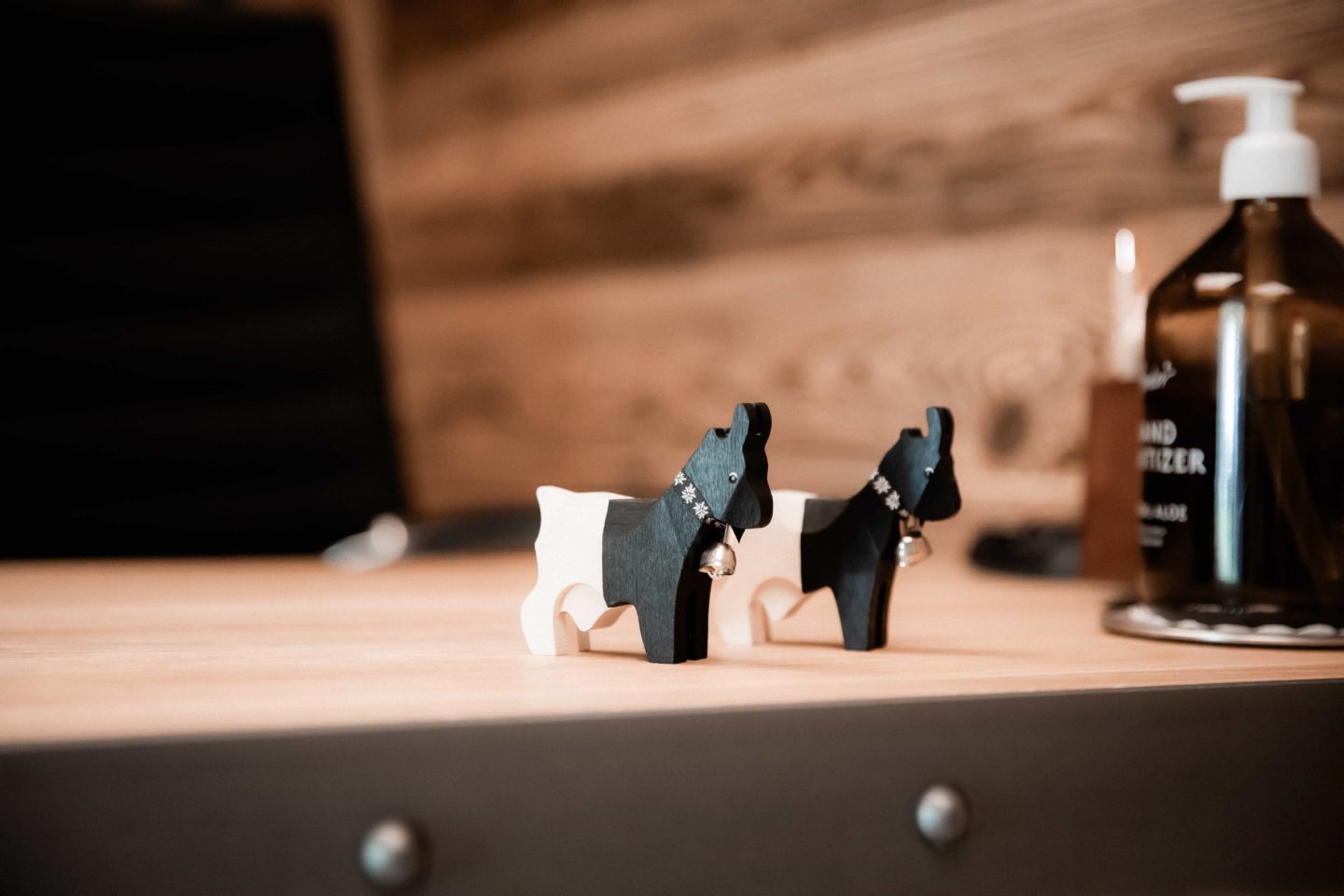 Small wooden horse beside a bottle, a serene wellness and spa atmosphere