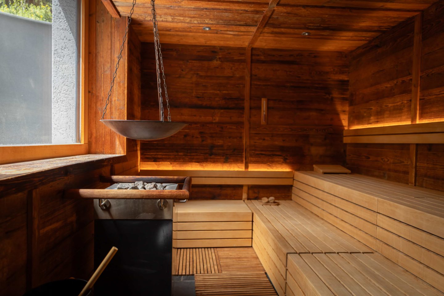 Sauna room featuring wooden benches at The Capra
